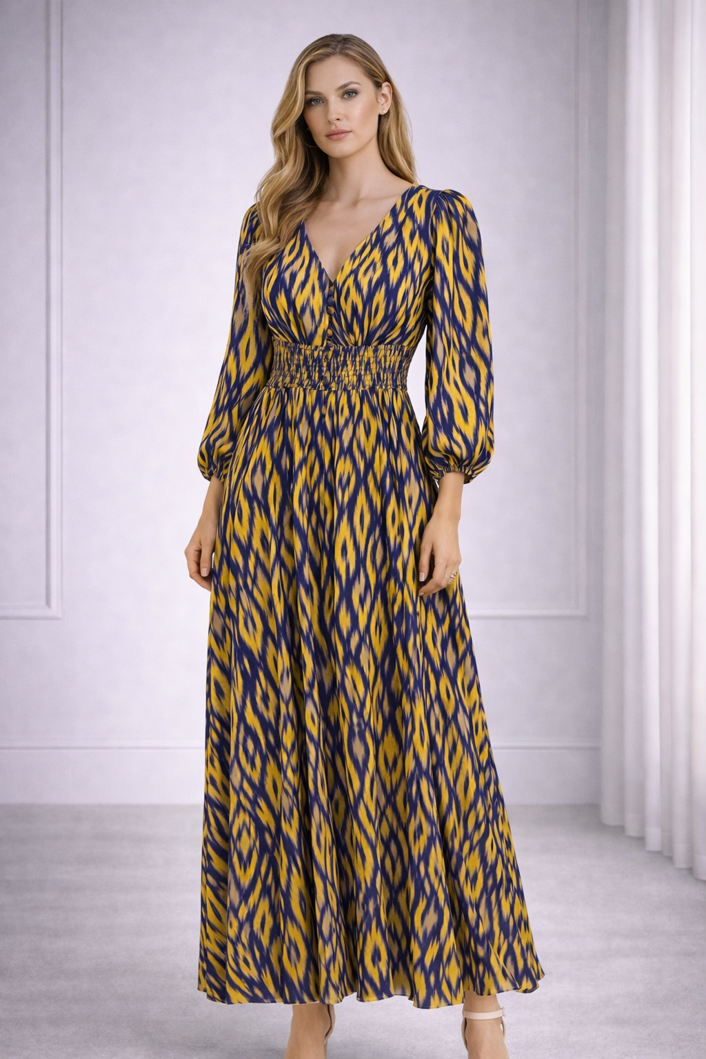 LALAH Woman wearing a long, patterned dress in a neutral setting