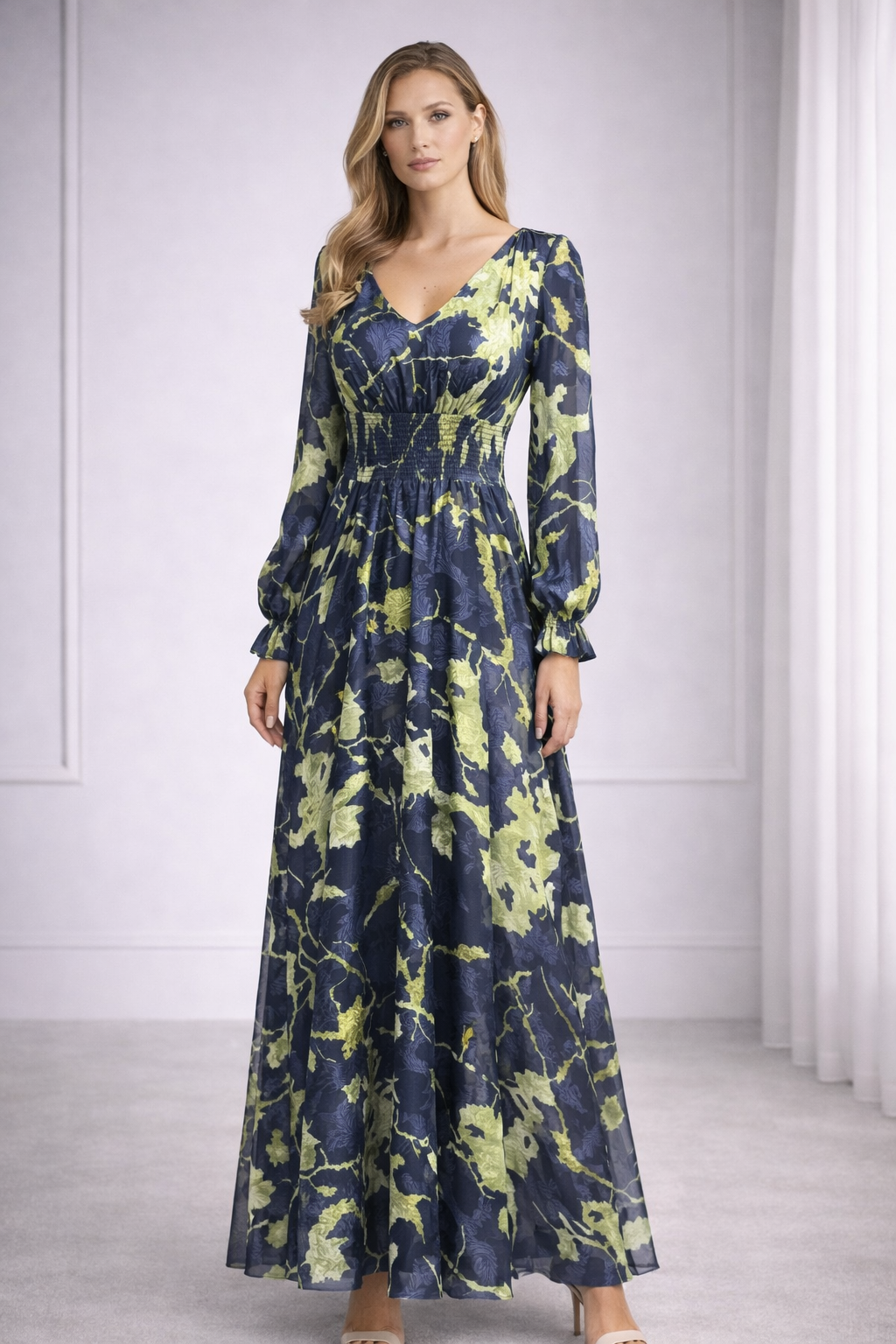 LALAH Woman wearing a long floral dress with a neutral background