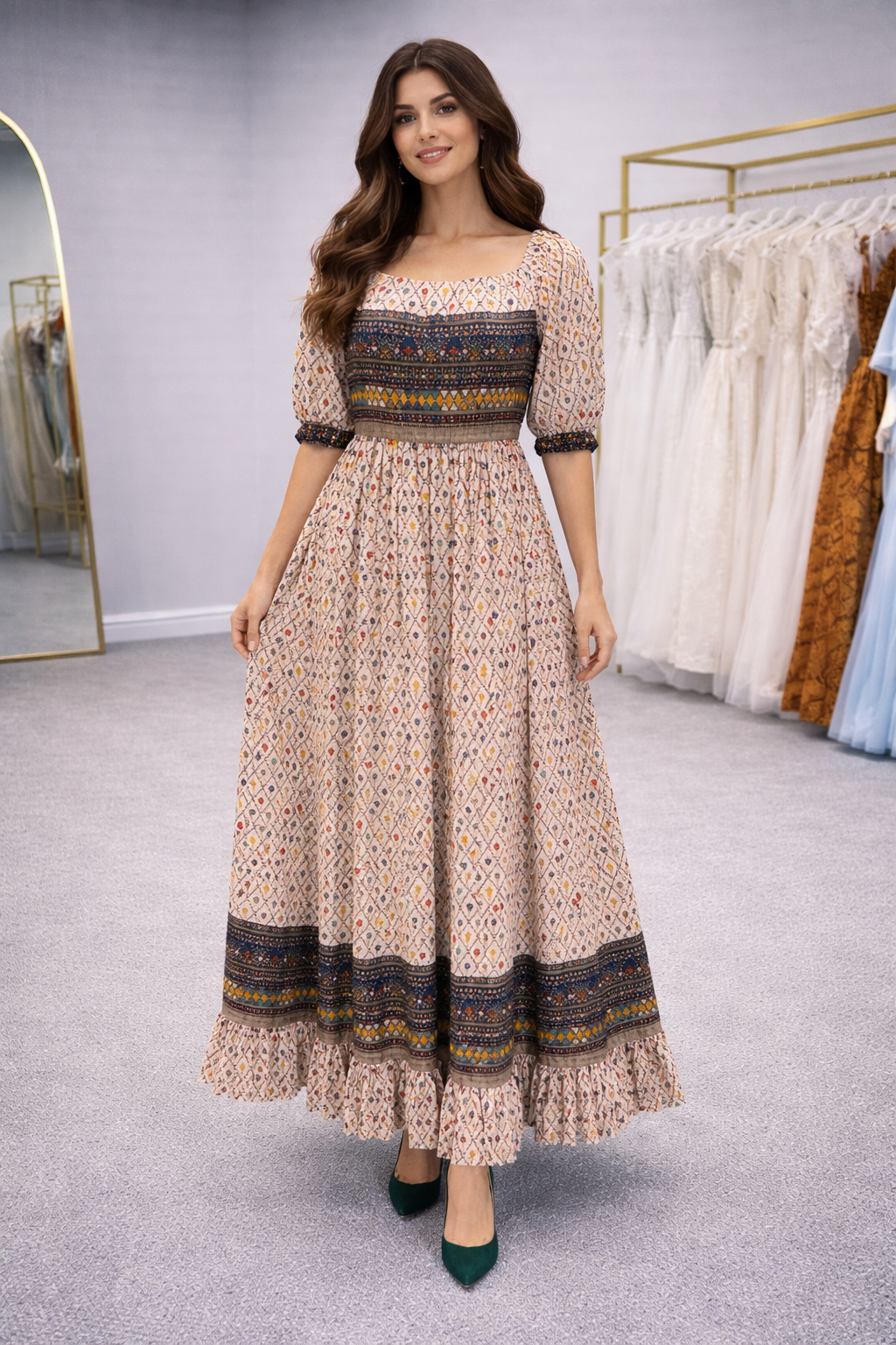 Lalah Woman wearing a long, patterned dress in a store setting