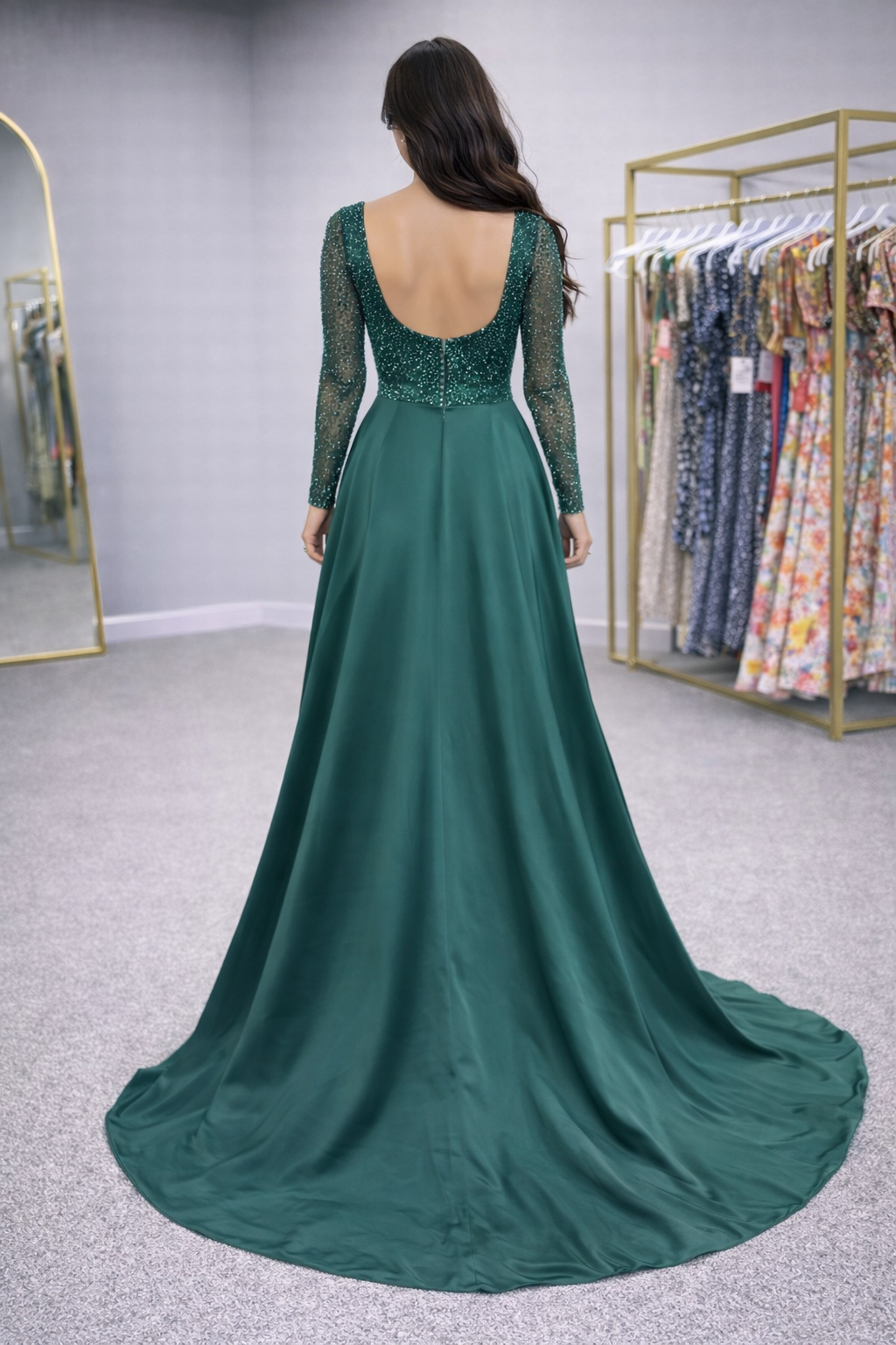 Green evening gown with lace detailing on a plain background